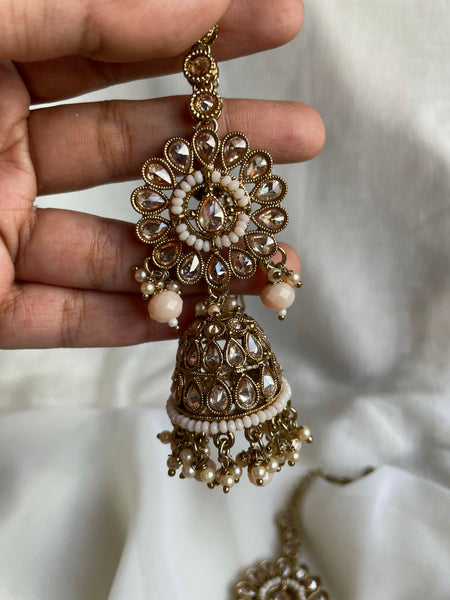 Pastel peach polki like jhumkas with tika