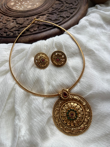Antique kemp chakra pendant with studs in a rope necklace