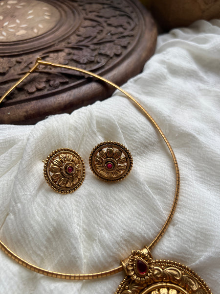 Antique kemp chakra pendant with studs in a rope necklace