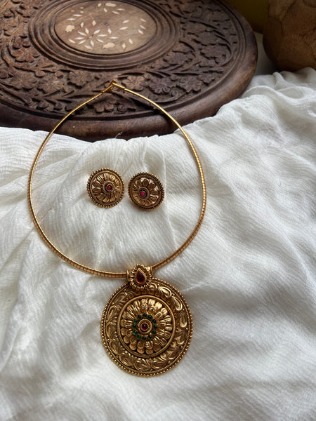 Antique kemp chakra pendant with studs in a rope necklace