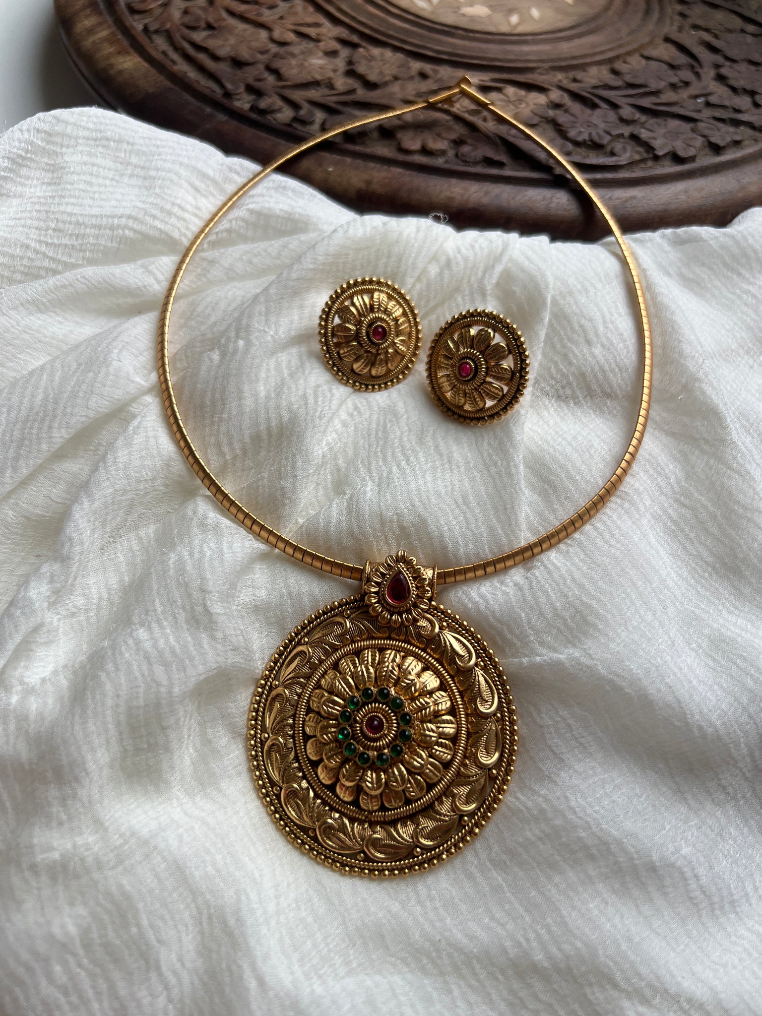 Antique kemp chakra pendant with studs in a rope necklace