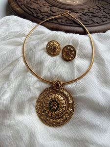 Antique kemp chakra pendant with studs in a rope necklace