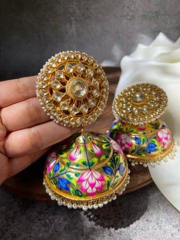 Oversized Kundan chakra studs with golden floral Jhumkas