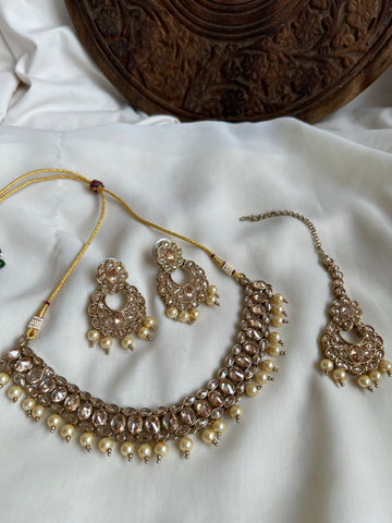 Polki like necklace with earrings and tika