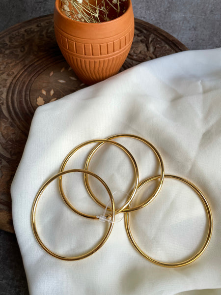 Set of 4 plain gold bangles