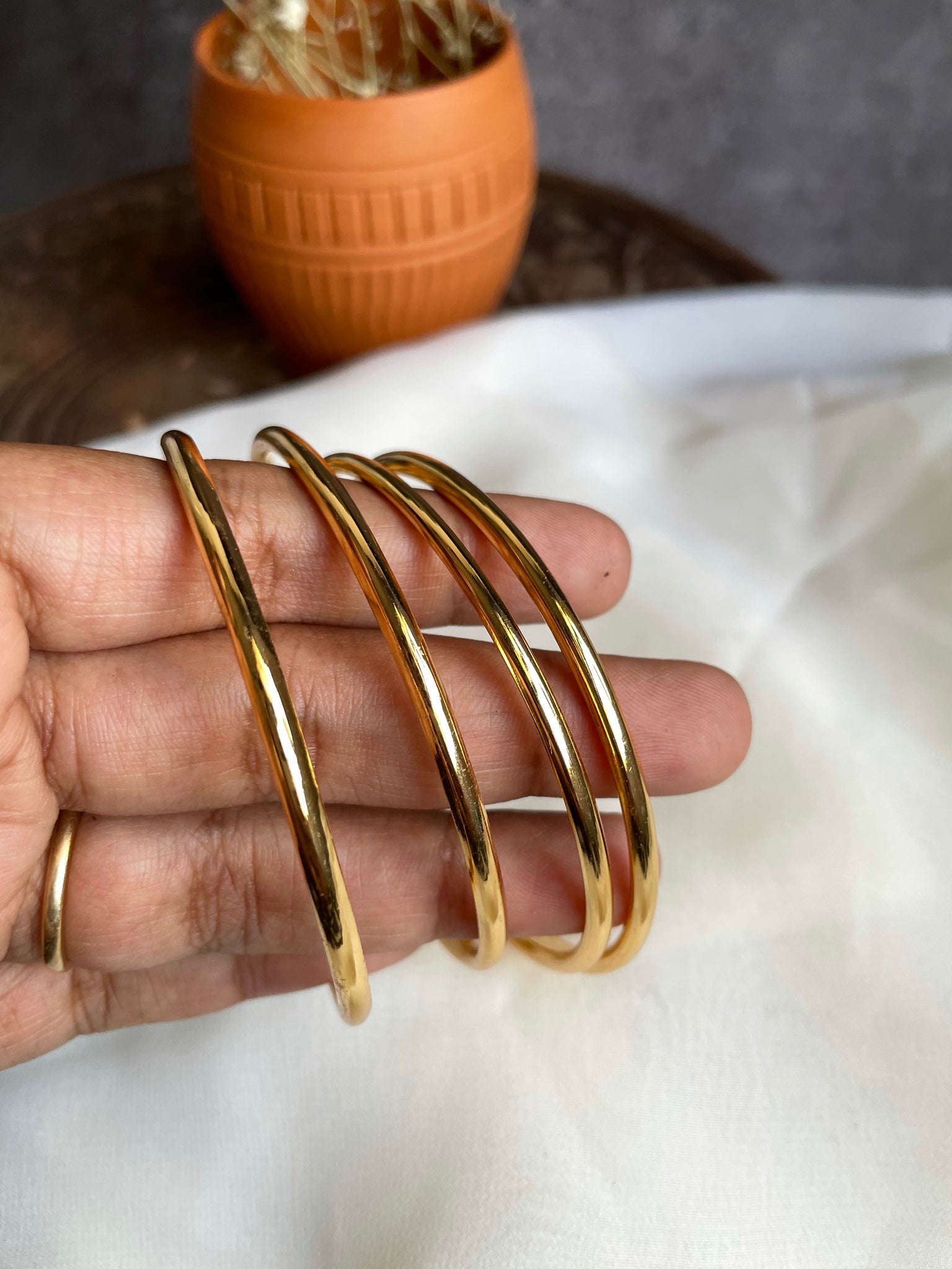 Set of 4 plain gold bangles