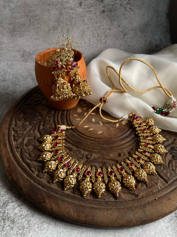 Ruby antique gold like necklace with Jhumkas