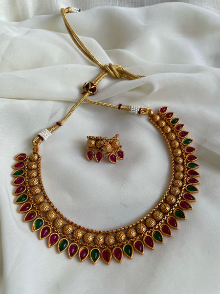 Kemp tear drop necklace with flower studs