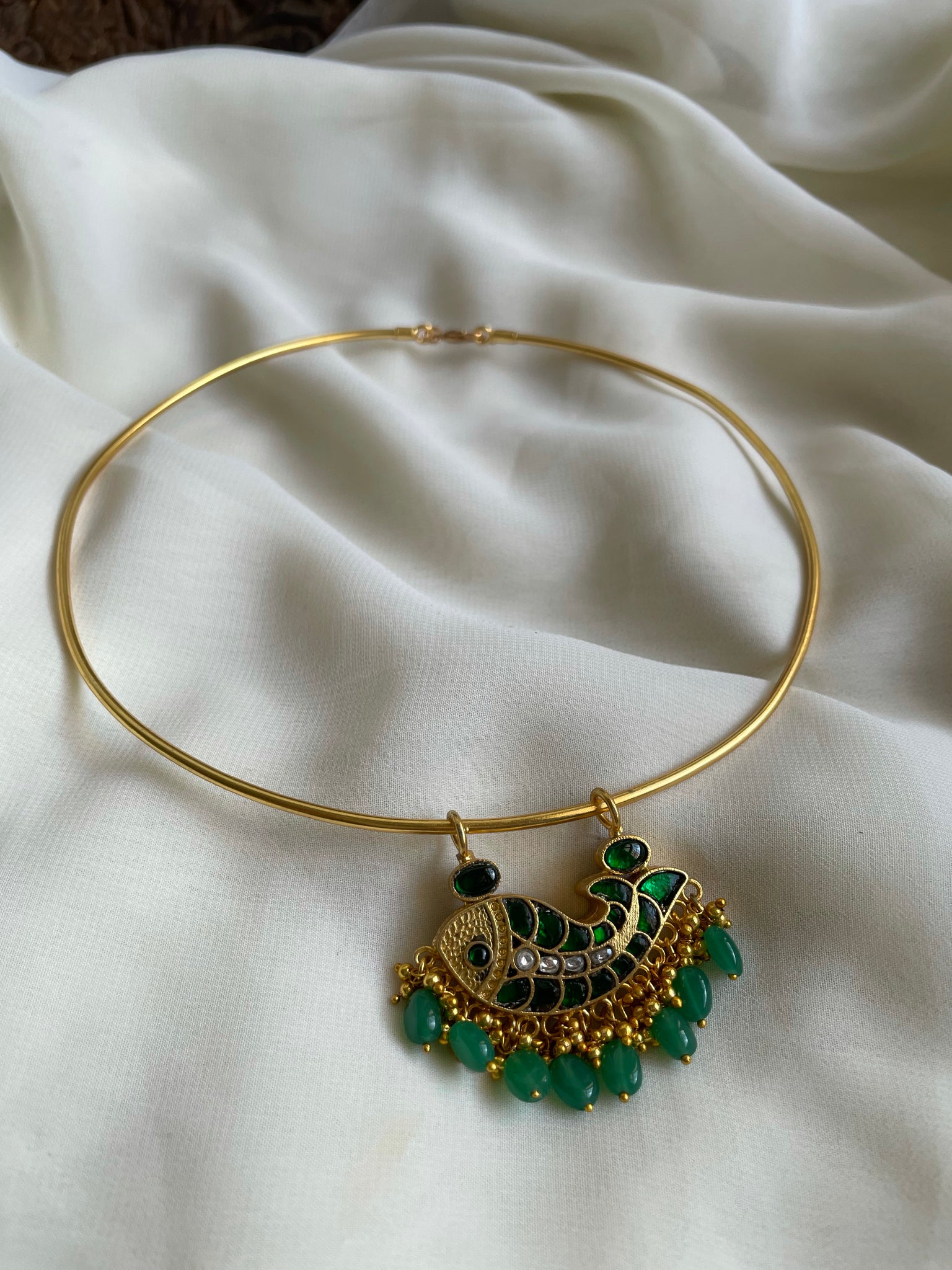 Reversible fish pendant with beads