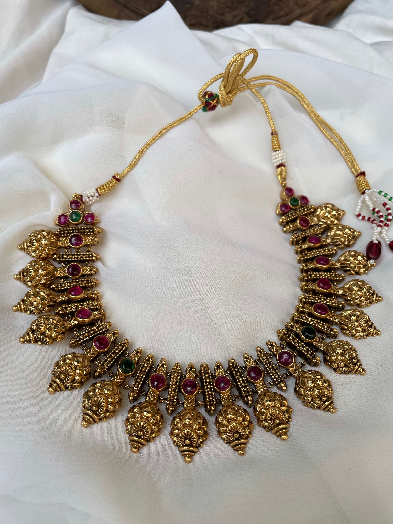 Ruby antique gold like necklace with Jhumkas
