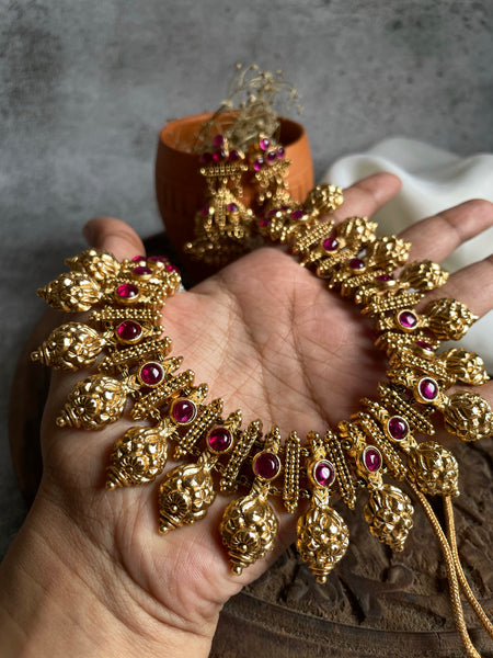 Ruby antique gold like necklace with Jhumkas