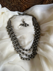 Oxidised dolki layered Maala with hook earrings