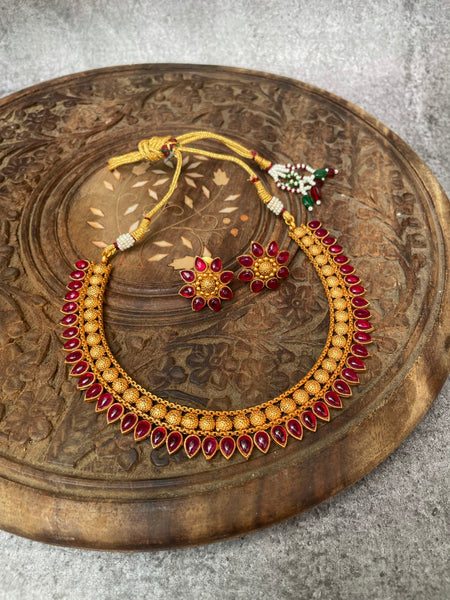 Kemp tear drop necklace with flower studs