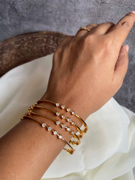 Stone studded think gold bangles set of 4