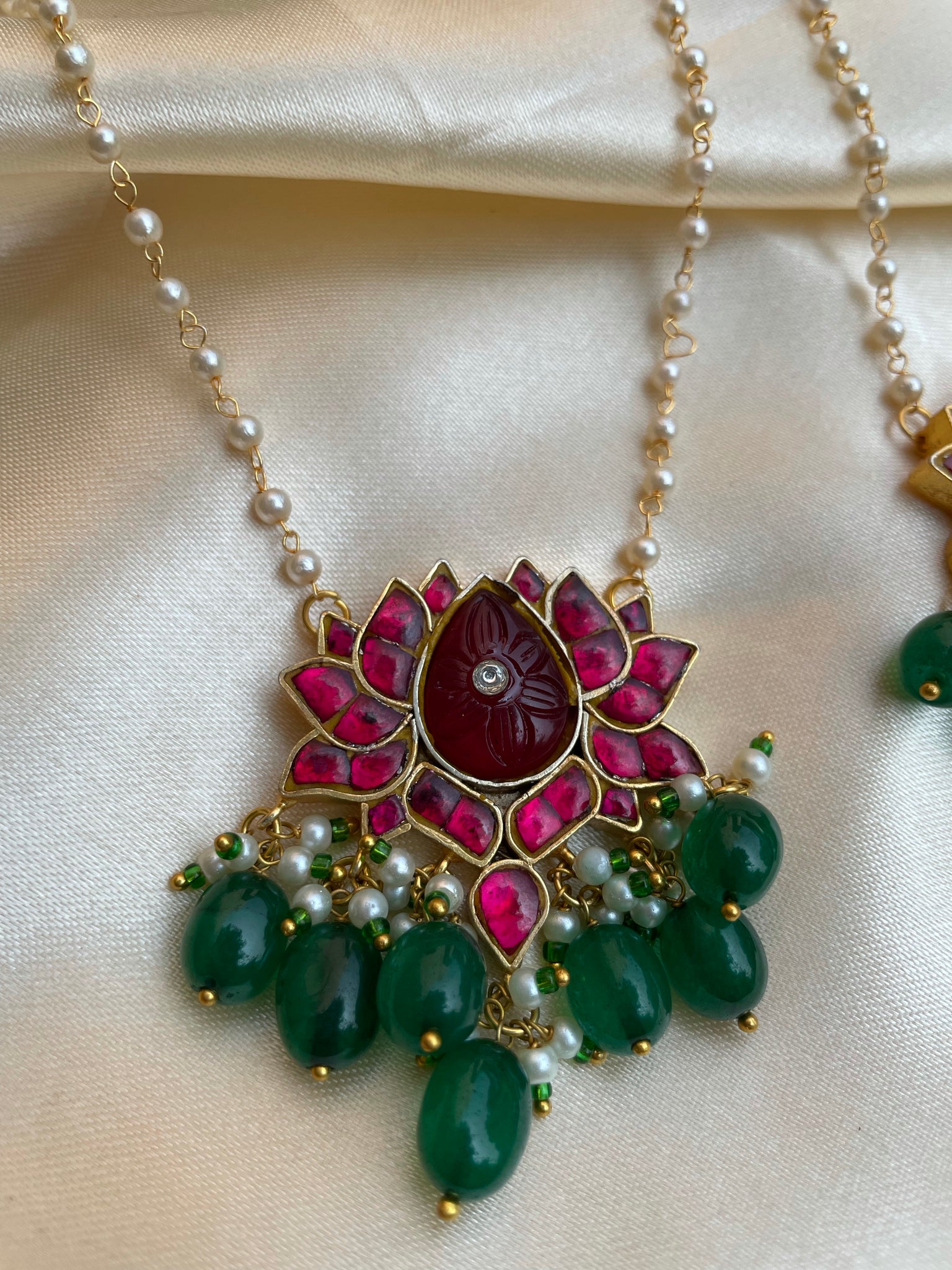 Kundan lotus pendant with carved stone