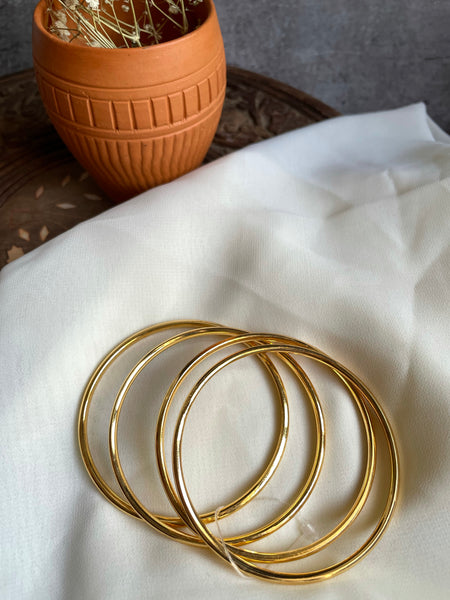 Set of 4 plain gold bangles