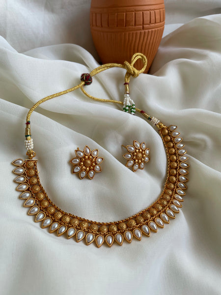 Kemp tear drop necklace with flower studs