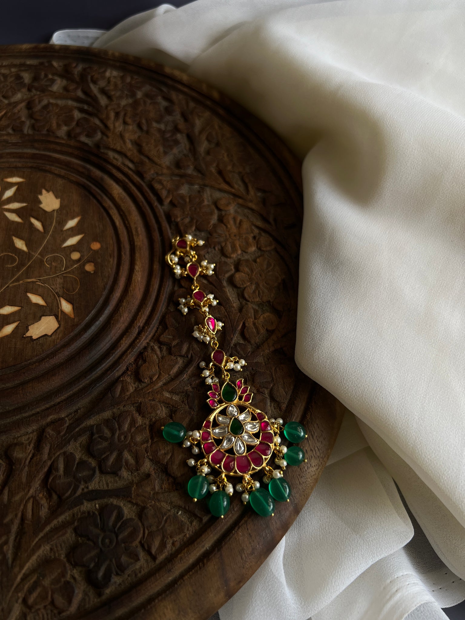 Kundan flower green bead tika