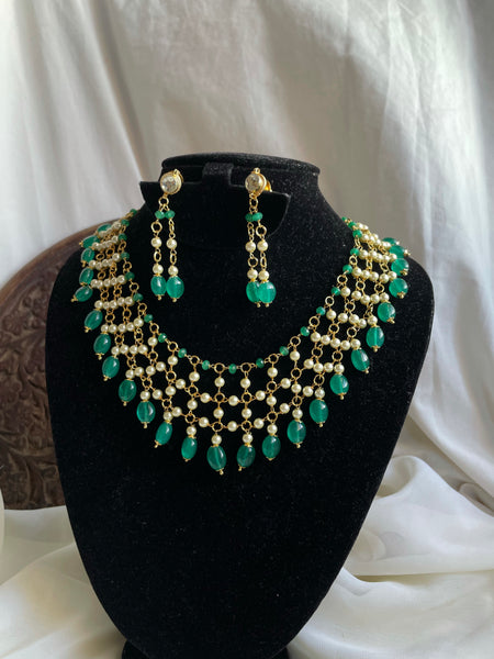 Jaali worked bead necklace with Kundan studded earrings