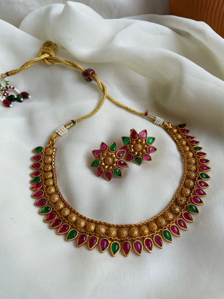 Kemp tear drop necklace with flower studs