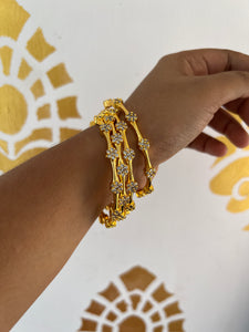 Ad flower golden bangles set of 4