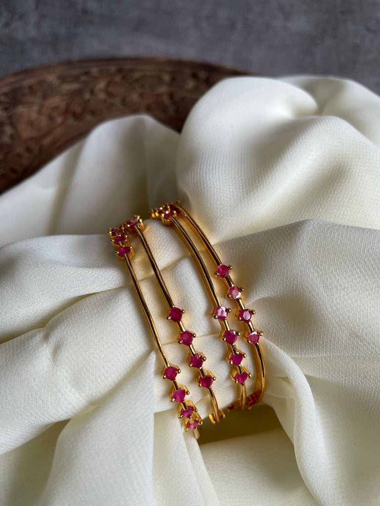 Gold stone bangles with weight discount